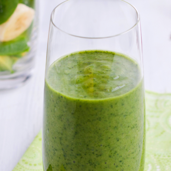 A green smoothie with spinach, kale, and banana.