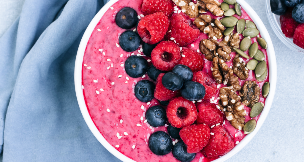 A delicious acai bowl with blueberries, banana, and almond milk.