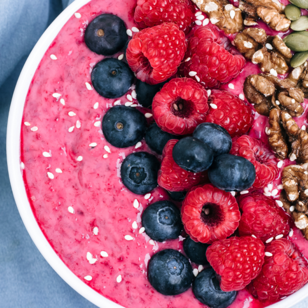 A delicious acai bowl with blueberries, banana, and almond milk.