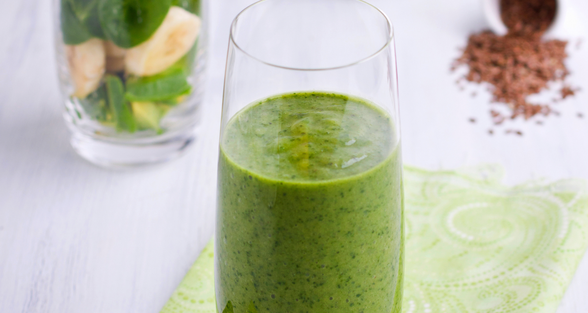 A green smoothie with spinach, kale, and banana.